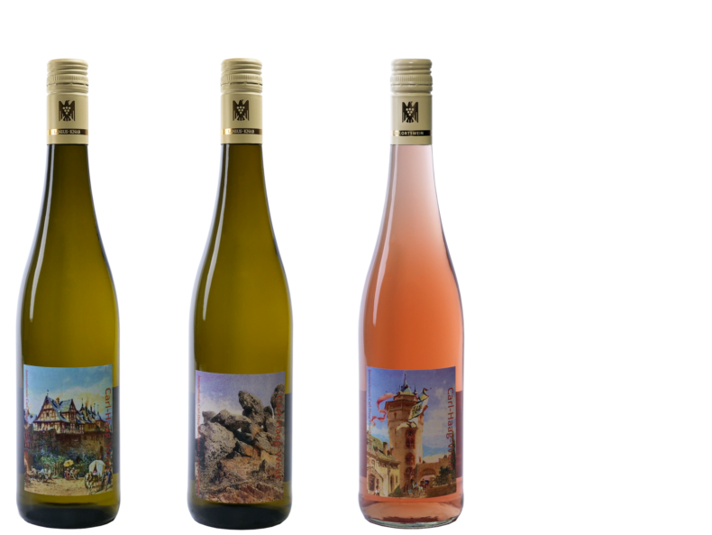 3 Weinflaschen. Die Etiketten zeigen die Aquarelle des Malers Carl Haag.